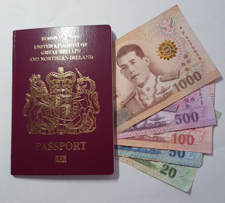 picture of passport and Thai money