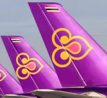 image showing tail fins of Thai Airways planes