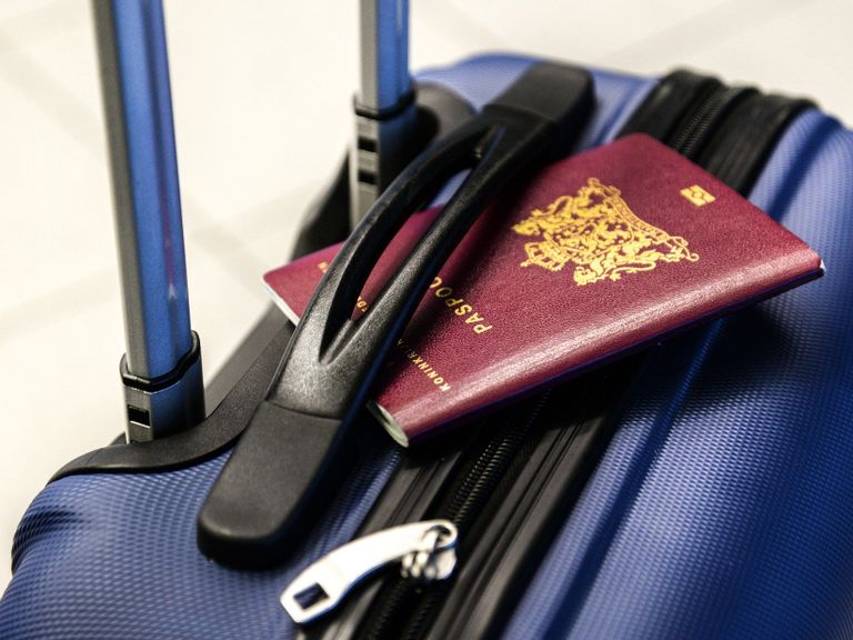 Picture of passport on top of bag