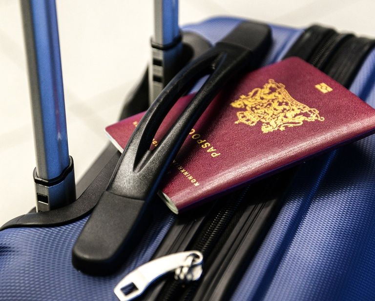 Picture of a passport on top of a bag