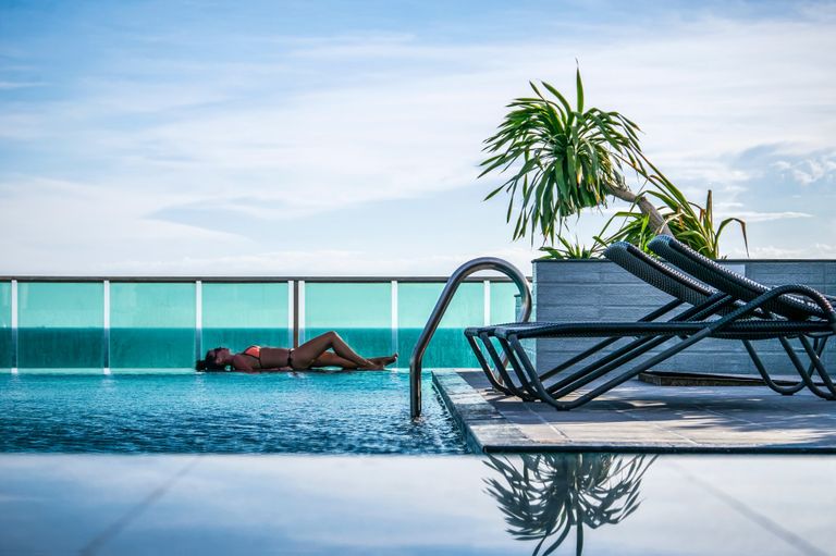 Picture of woman relaxing poolside