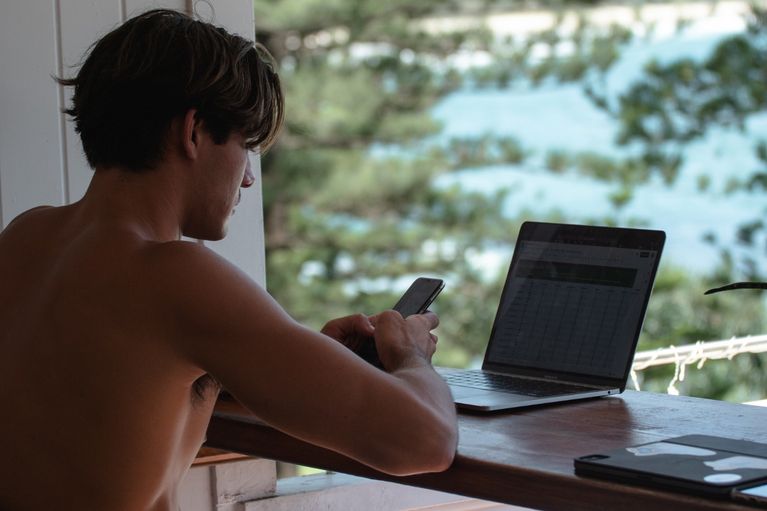 photo of man working on laptop