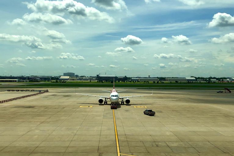 Image of a plane on the runway at Bangkok Don Mueang Airport 