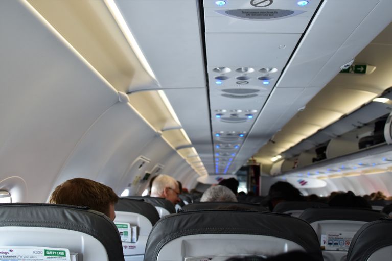 image of passengers on a plane 