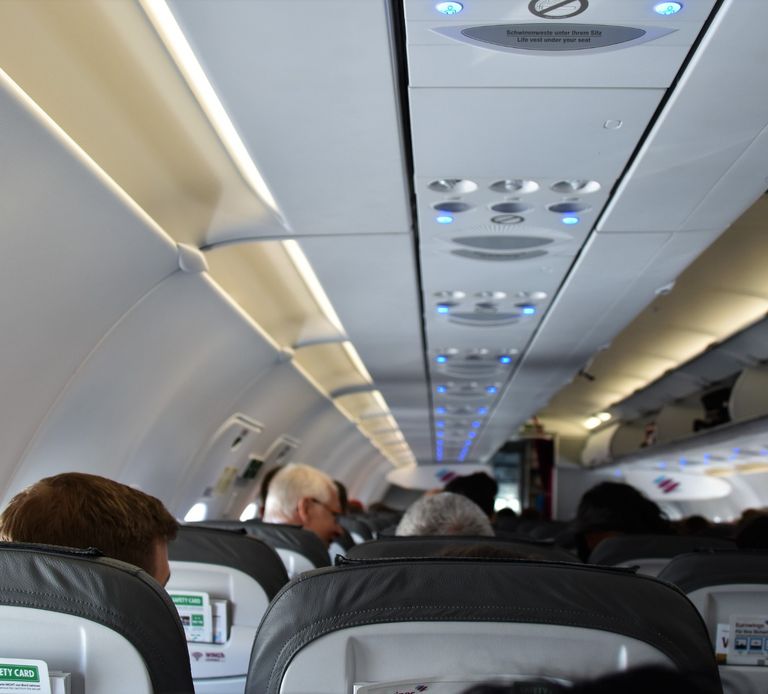 photo of passengers on a plane