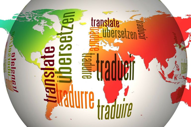 Image of the world overlaid with the word 'translate' in multiple languages