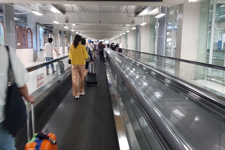 photo of lady looking at departures board